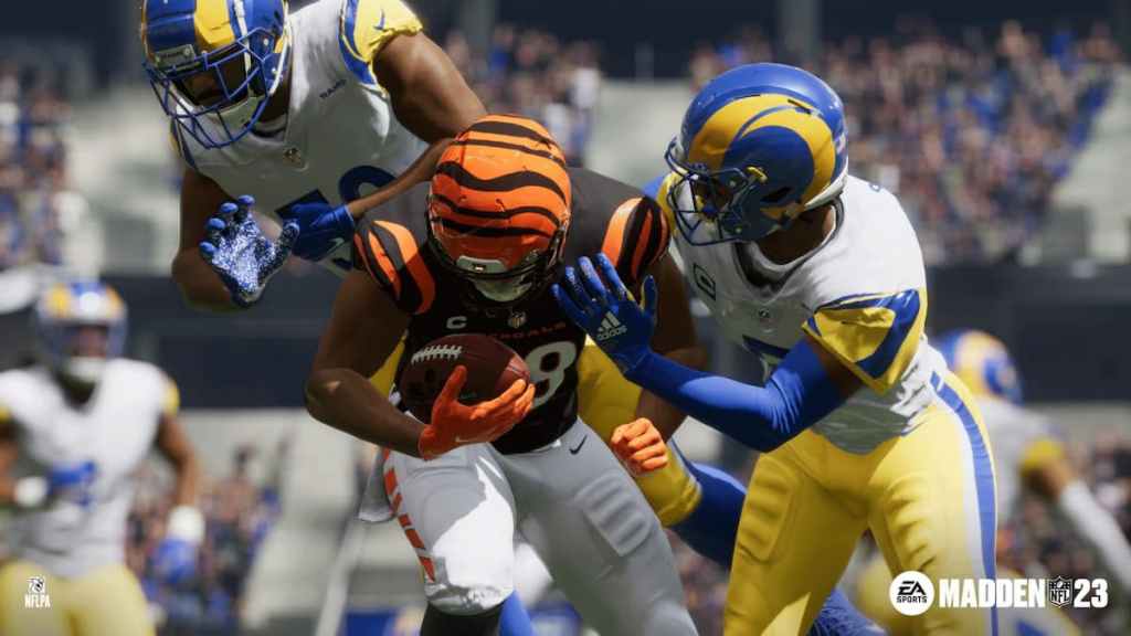 Madden 23 screenshot of bengals player getting tackled by rams players