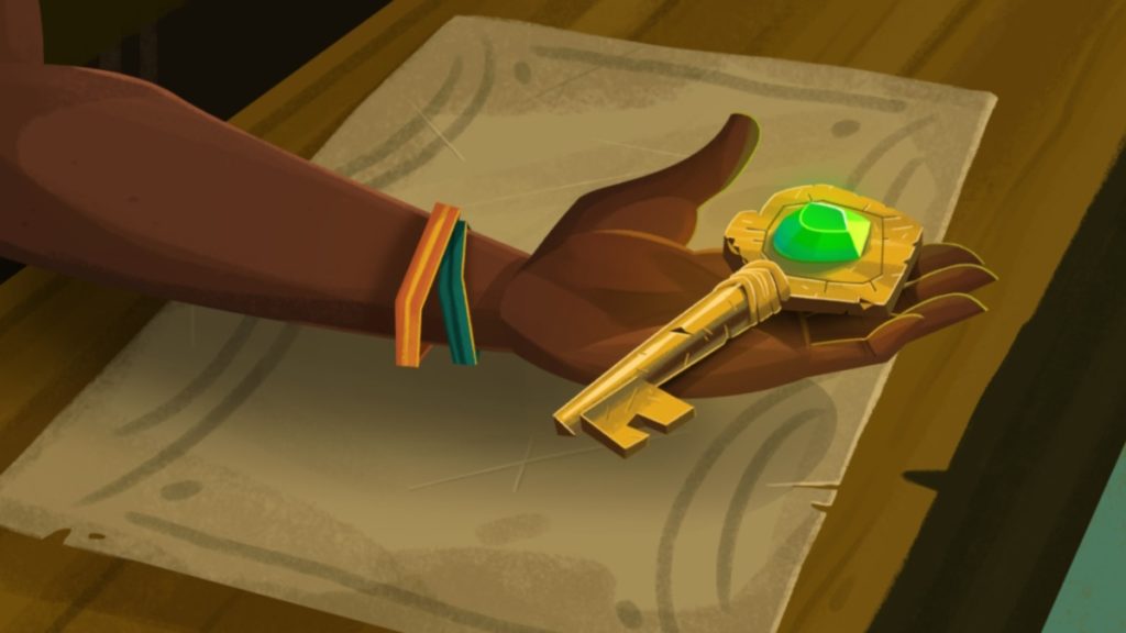 a dark-skinned hand holds out a gold key across a counter. the handle of the key is embossed with a green gem 
