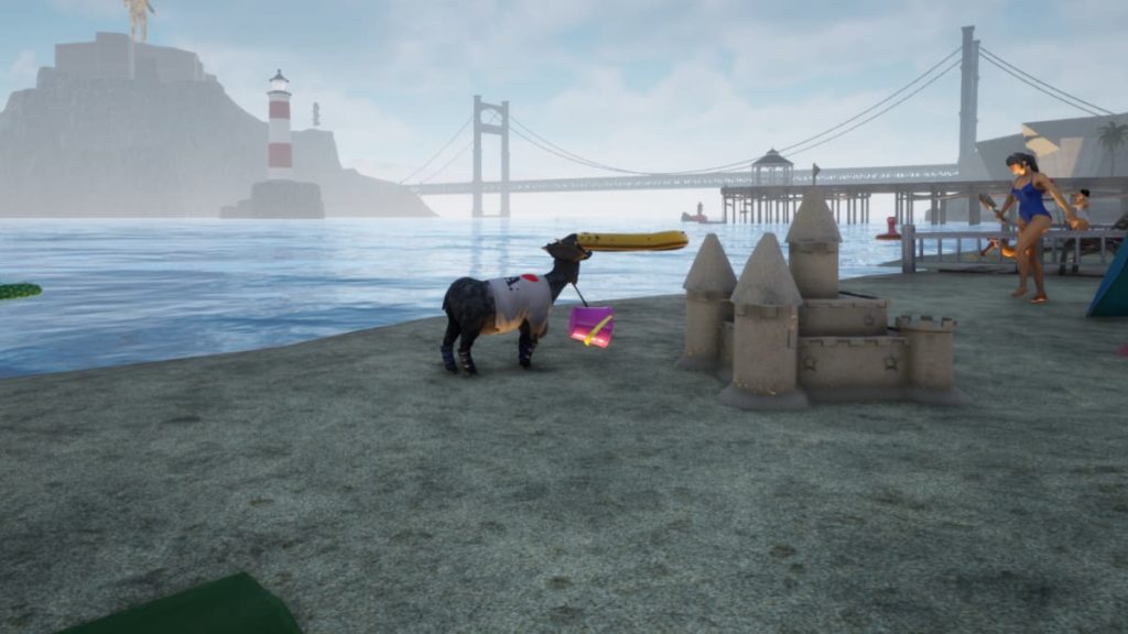 Goat with a purple bucket on the beach