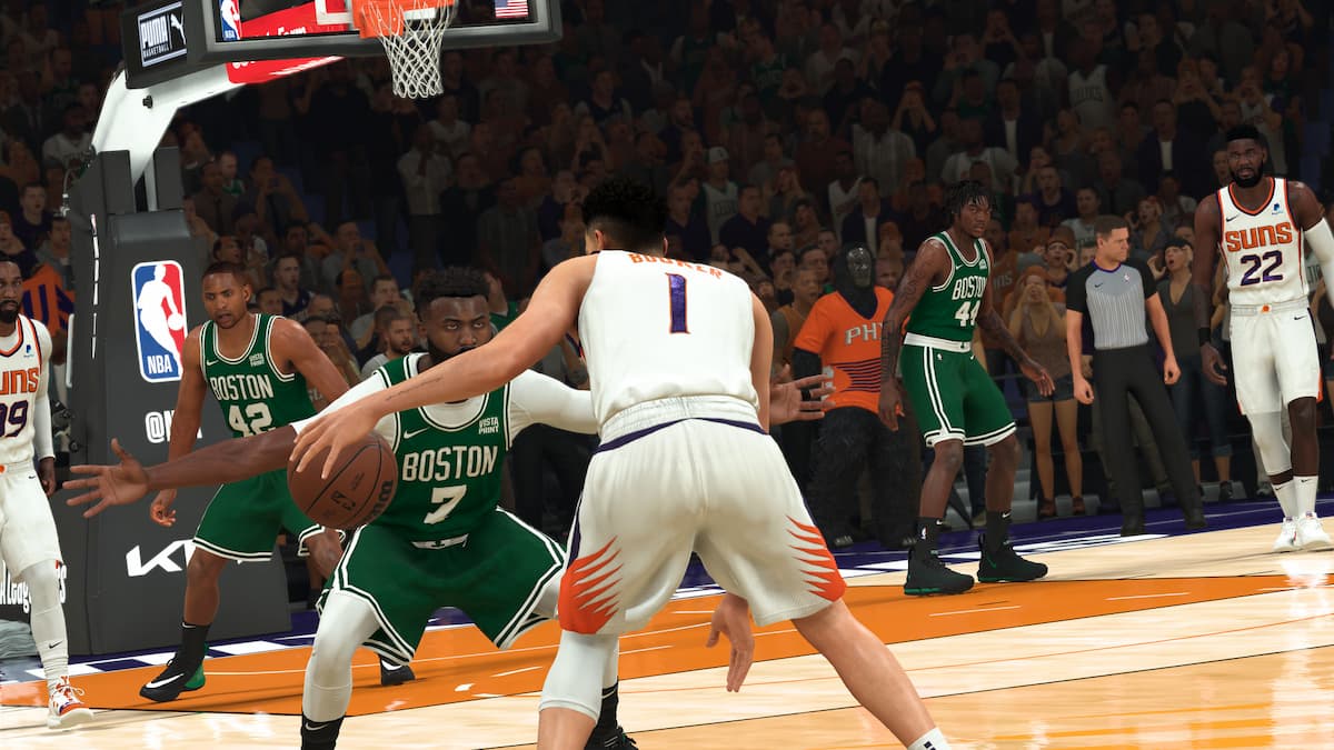 A player trying to cut past another player in a basketball game in NBA 2K23.