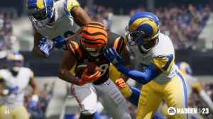 Two players trying to tackle enemy player with the ball in Madden 23.