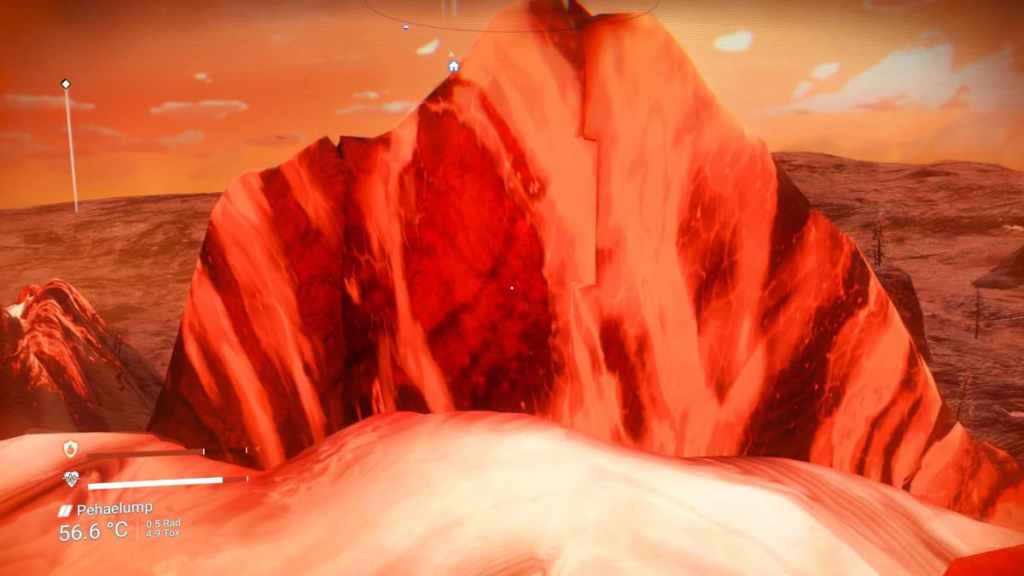 The lip of a volcano from inside a reddish orange blob of lava